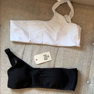 One billabong bikini top with tags.